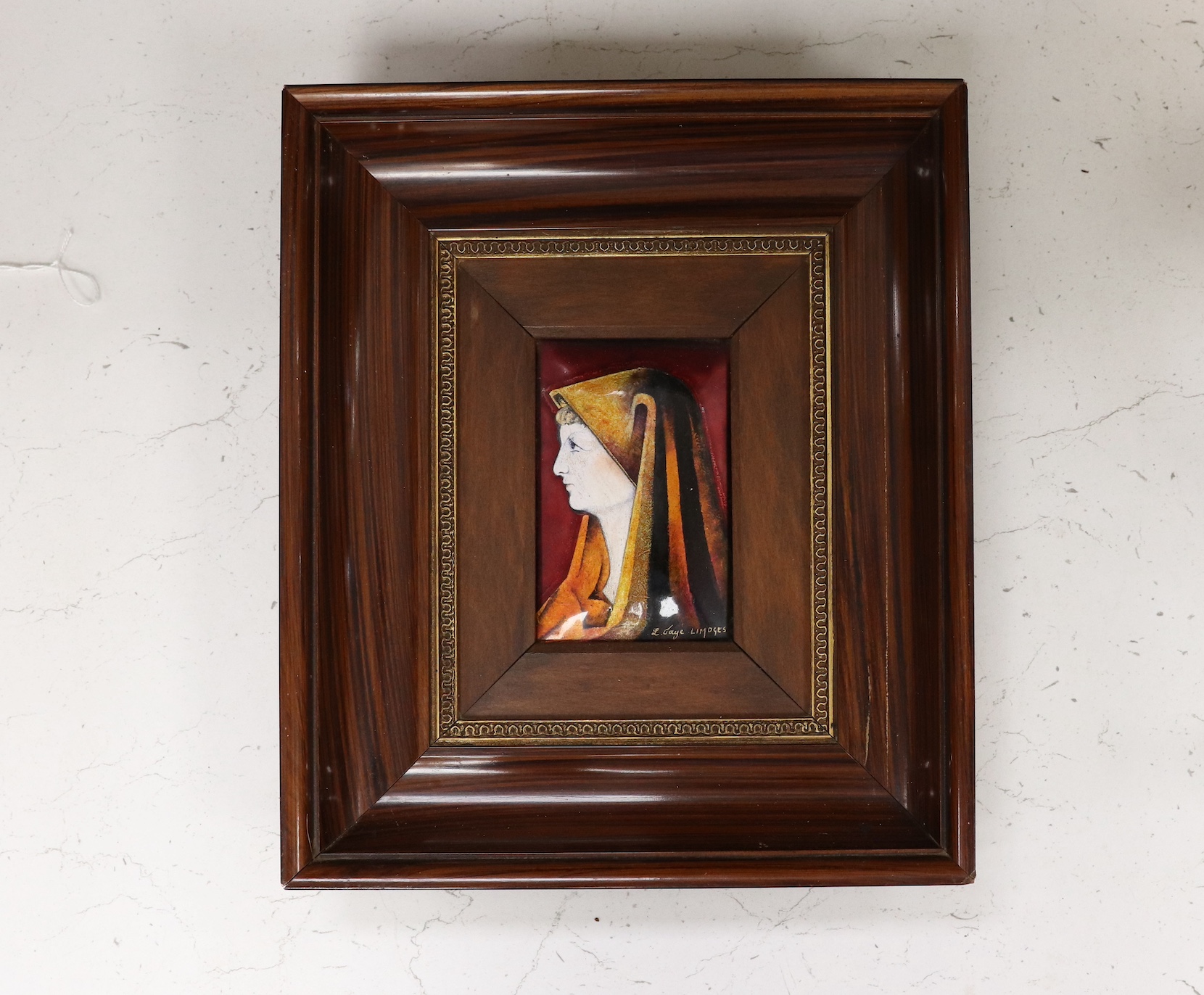 A framed Limoges plaque, signed L. Faye Limoges, frame 29cm high, 25cm wide. Condition - fair to good